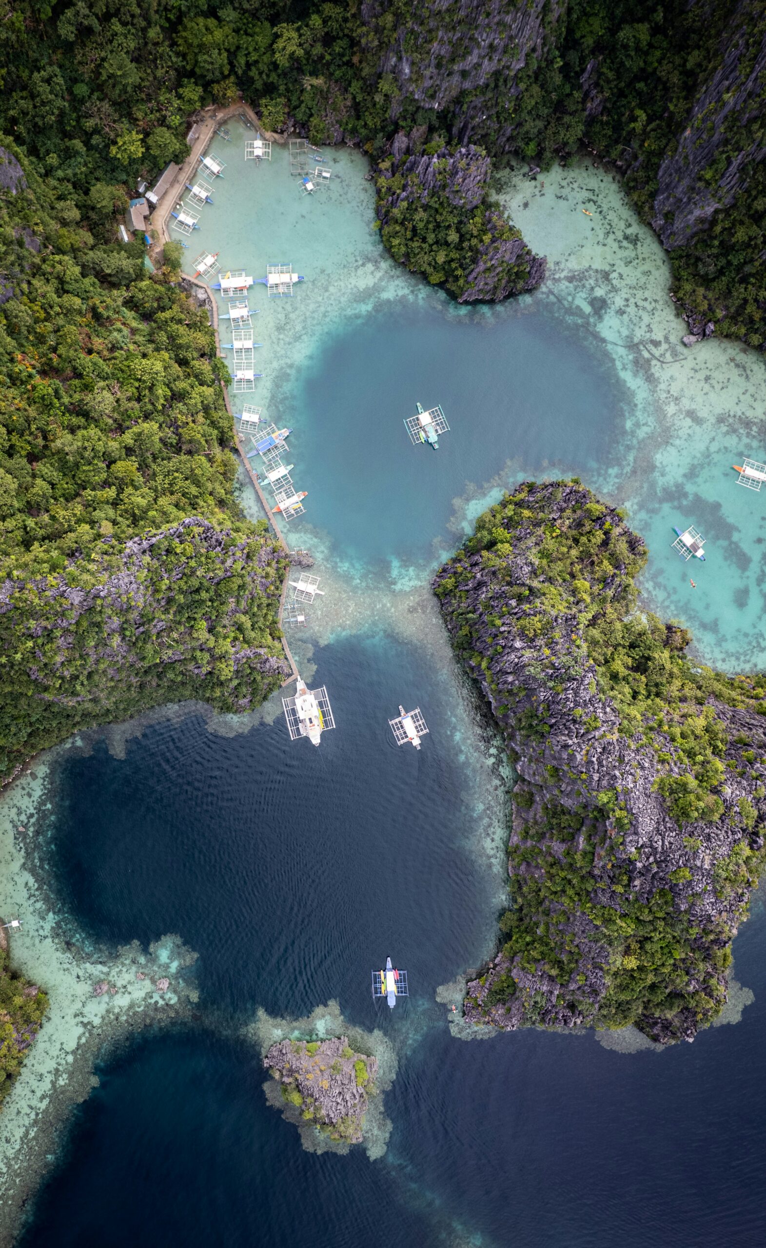 Aerial view of El Nido lagoons and outrigger boats, Palawan