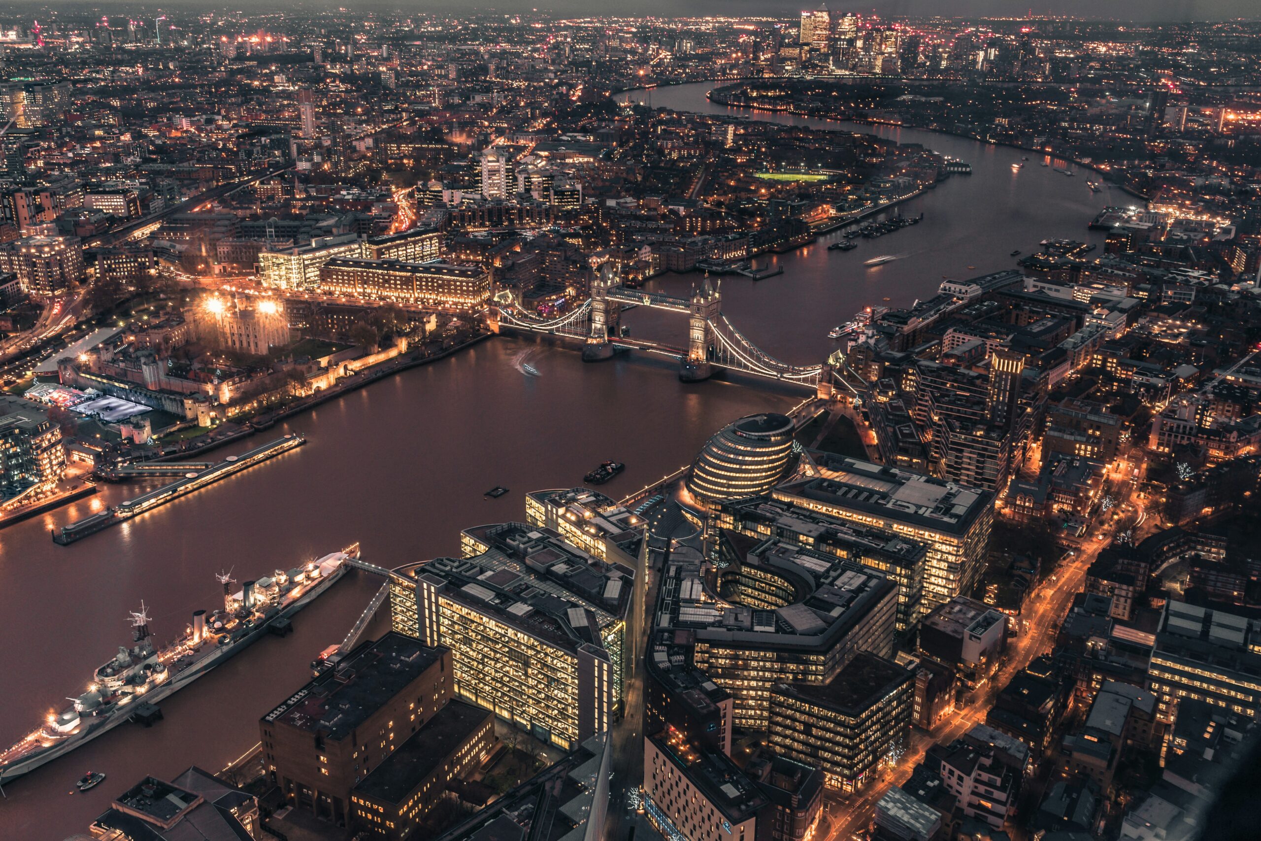 London aerial view with Tower Bridge and the Thames at night