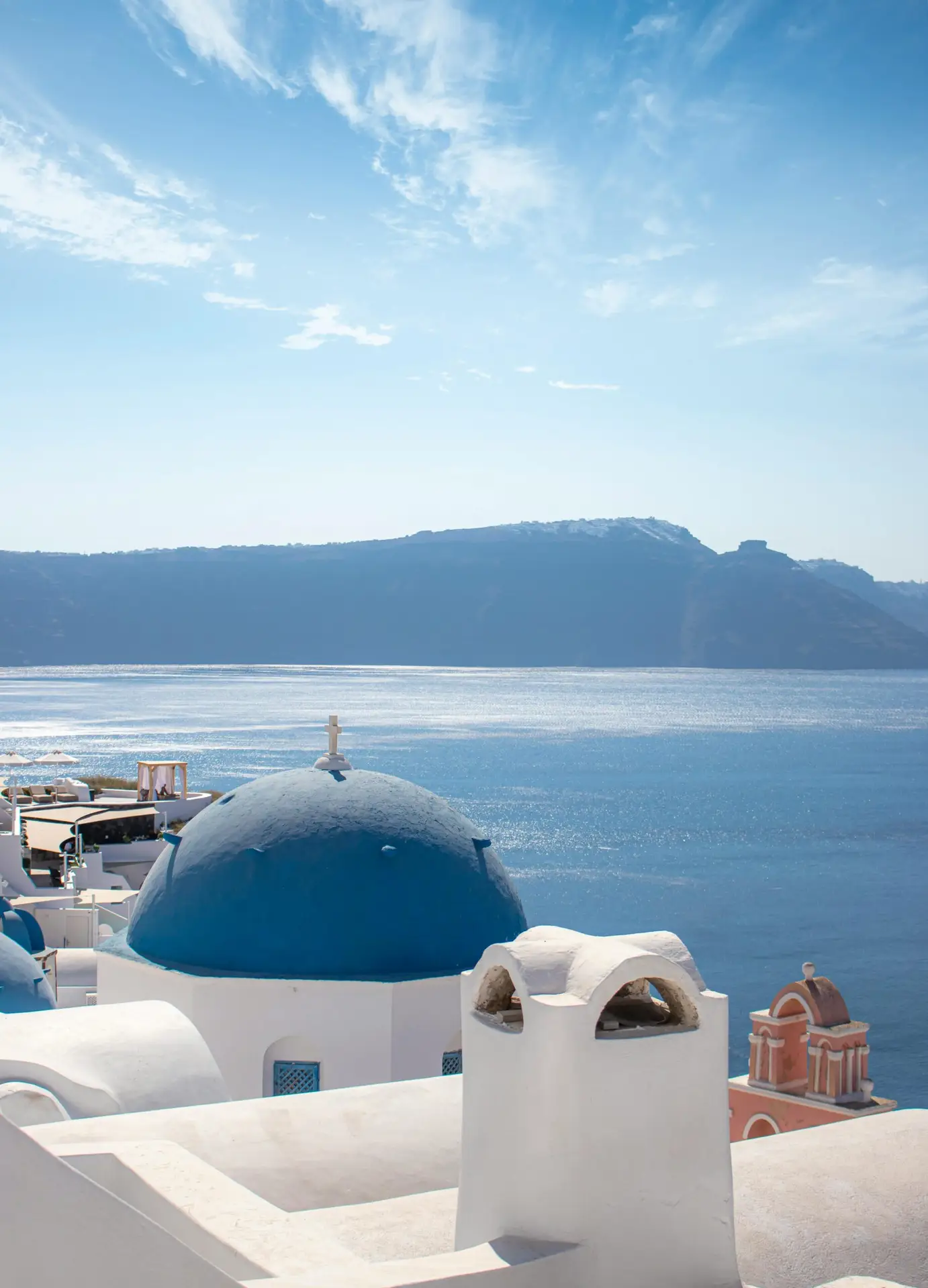 Blue domed church and caldera view in Santorini, Greece